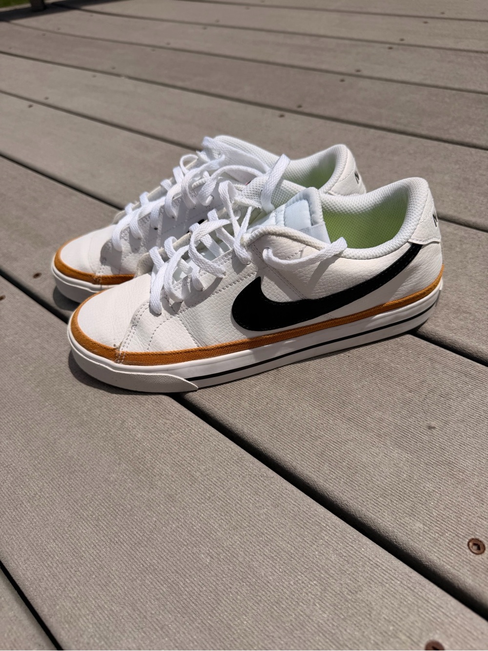 Nike White Low-Top Sneakers with Black Swoosh and Orange Accent size 8.5
